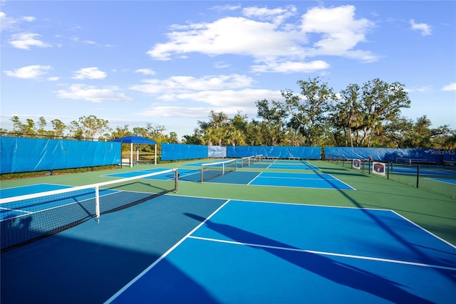 view of tennis court with community basketball court