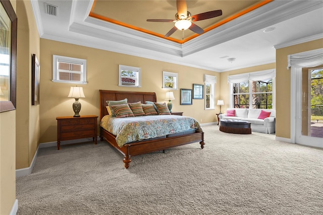 bedroom featuring crown molding, carpet floors, a raised ceiling, and access to exterior