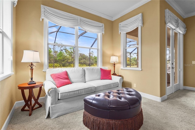 living area featuring baseboards, carpet, a wealth of natural light, and crown molding