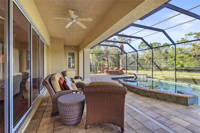 view of patio featuring outdoor lounge area, a lanai, a ceiling fan, and an outdoor pool