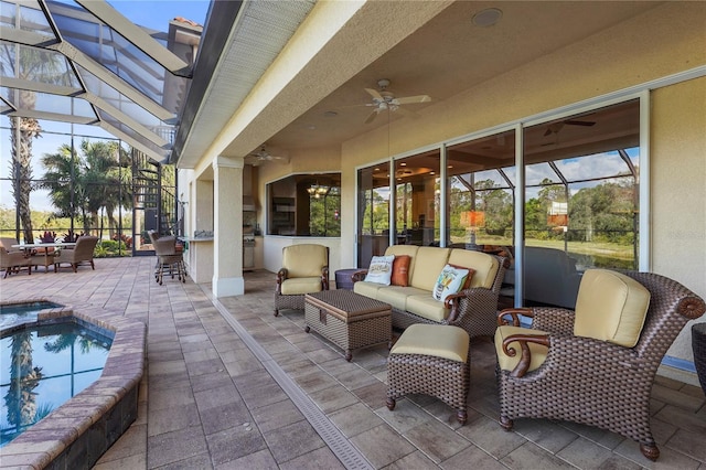 view of patio with a lanai, ceiling fan, outdoor dry bar, and an outdoor hangout area