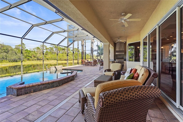 view of patio featuring a lanai, ceiling fan, an outdoor hangout area, and outdoor dining space