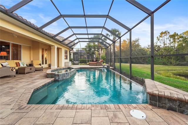 view of pool with a pool with connected hot tub, glass enclosure, a patio, and an outdoor hangout area