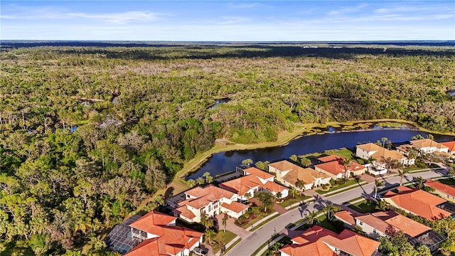 drone / aerial view featuring a residential view and a water view