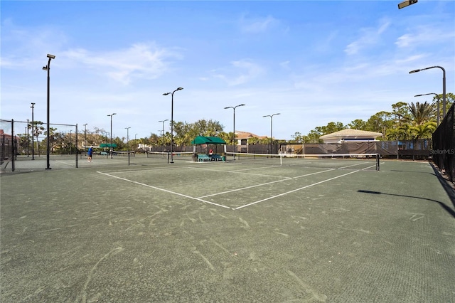 view of sport court with fence