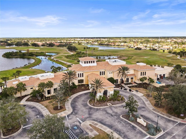 bird's eye view with a water view and golf course view