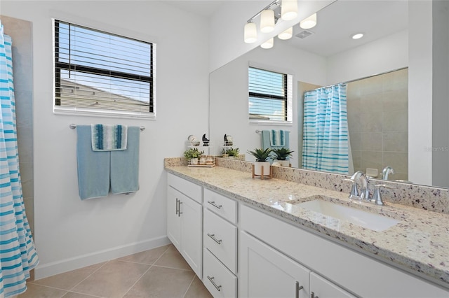 full bath featuring visible vents, baseboards, a shower with curtain, vanity, and tile patterned floors