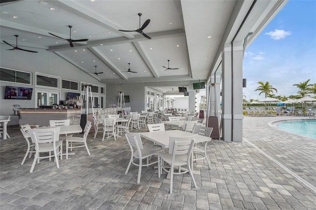 dining area with high vaulted ceiling, beamed ceiling, a ceiling fan, and recessed lighting