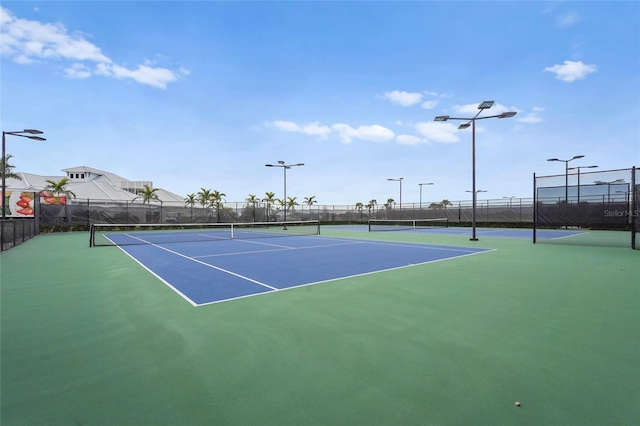 view of sport court with community basketball court and fence