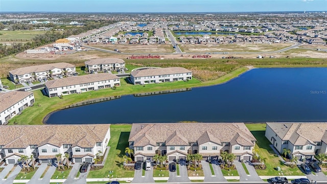 birds eye view of property with a residential view and a water view