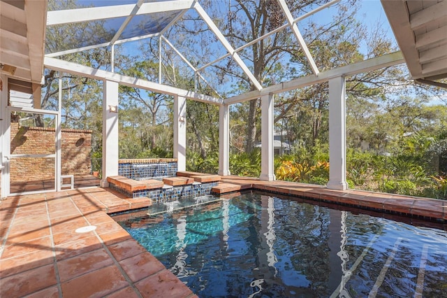 view of swimming pool with a patio and a lanai