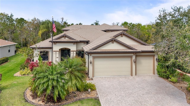 view of front of house featuring a tiled roof and decorative driveway