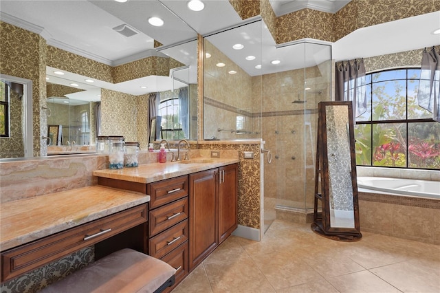 full bathroom with a garden tub, tile patterned flooring, vanity, ornamental molding, and a shower stall