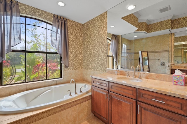 bathroom featuring wallpapered walls, vanity, a shower stall, a bath, and recessed lighting