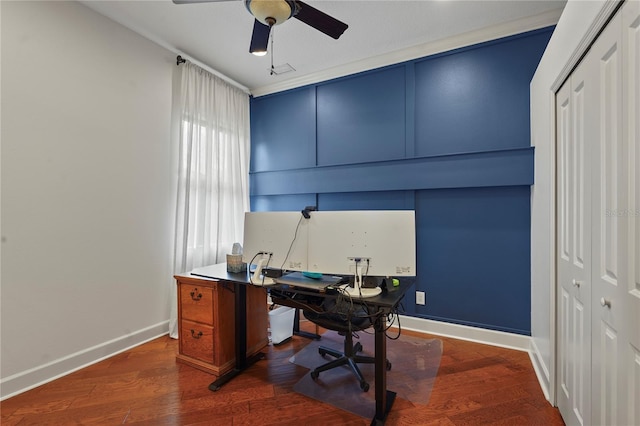 office space with wood finished floors, a ceiling fan, and baseboards