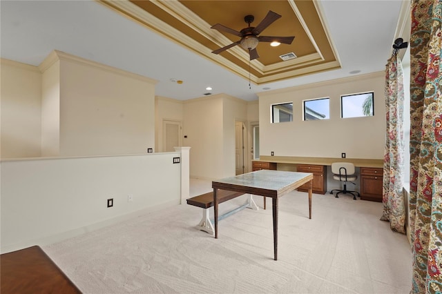 office featuring light carpet, visible vents, a raised ceiling, crown molding, and recessed lighting