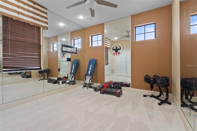 exercise area featuring carpet floors, recessed lighting, and baseboards