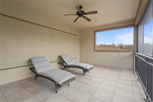 exterior space featuring light tile patterned floors and ceiling fan