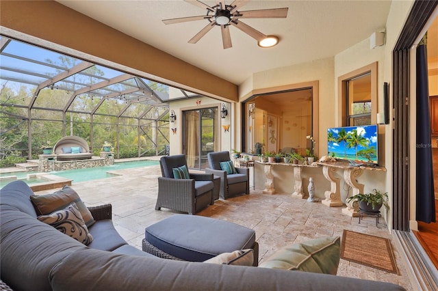 view of patio featuring a ceiling fan, glass enclosure, an outdoor pool, and an outdoor living space