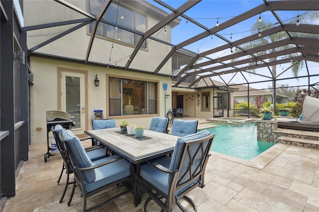 view of swimming pool featuring outdoor dining area, a patio area, a lanai, and a pool with connected hot tub