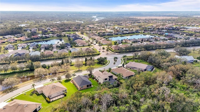 aerial view with a residential view and a water view