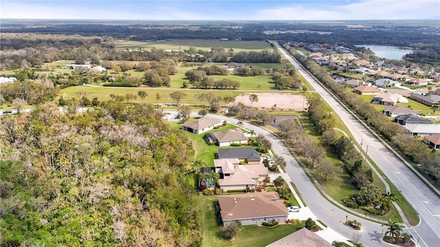 bird's eye view with a water view and a residential view