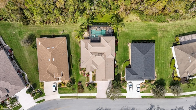 birds eye view of property with a residential view