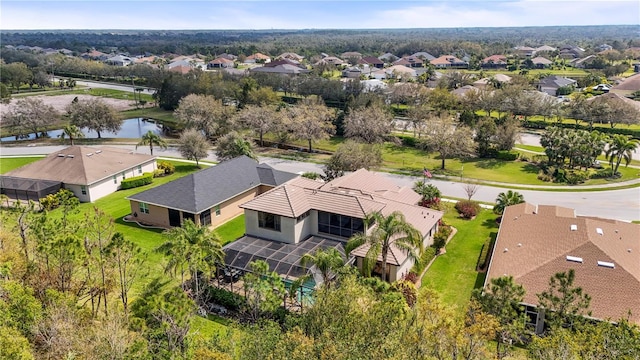 bird's eye view with a residential view and a water view