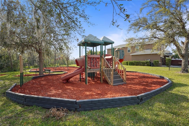 community playground featuring a lawn