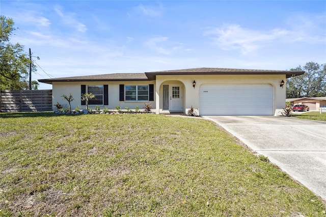 ranch-style home featuring a front lawn, fence, stucco siding, a garage, and driveway