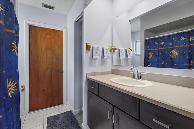 full bath featuring tile patterned floors, visible vents, vanity, and baseboards