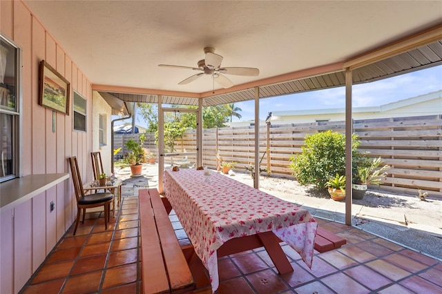 view of patio with a fenced backyard and a ceiling fan