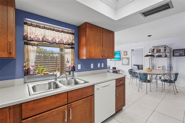 kitchen with visible vents, a sink, light countertops, dishwasher, and hanging light fixtures