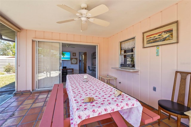 interior space with ceiling fan