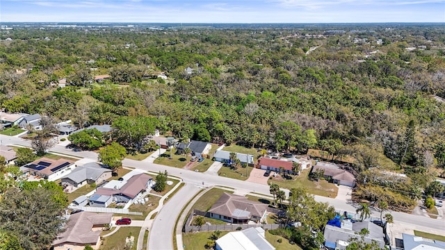 bird's eye view with a forest view and a residential view