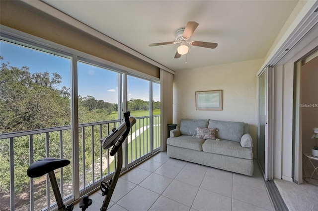 sunroom with a ceiling fan