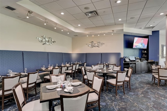 dining area with visible vents, a drop ceiling, and recessed lighting