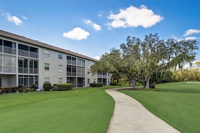 view of home's community featuring a lawn