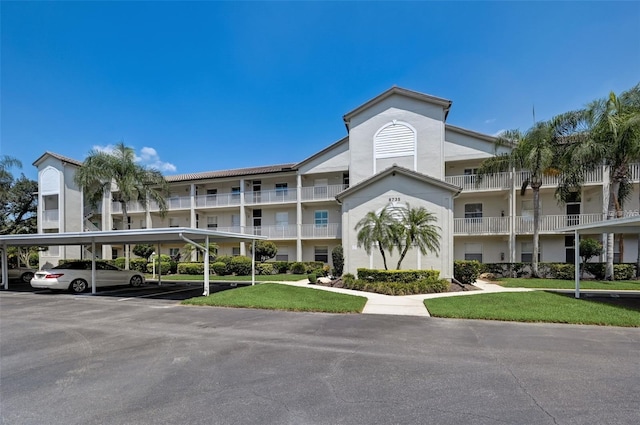 view of property with covered parking