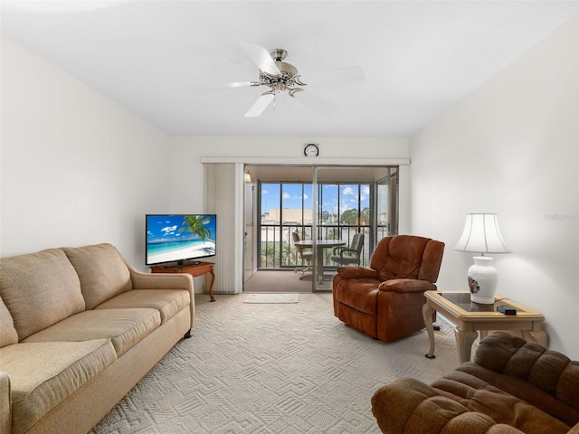 living room featuring light carpet and ceiling fan