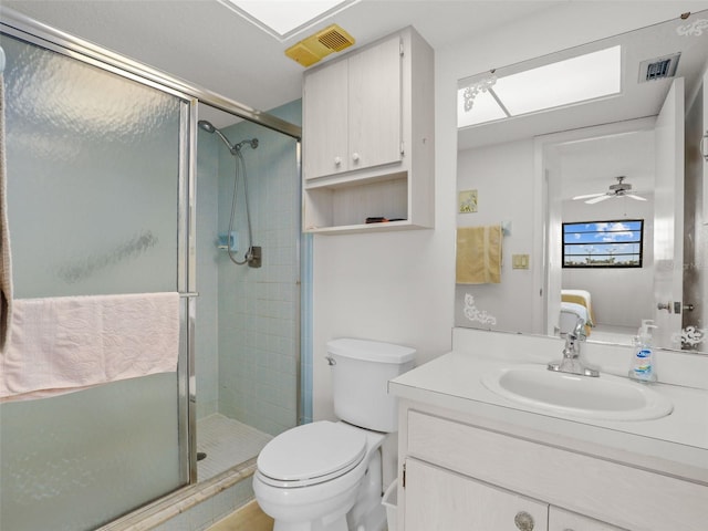 ensuite bathroom with visible vents, connected bathroom, a shower stall, and vanity