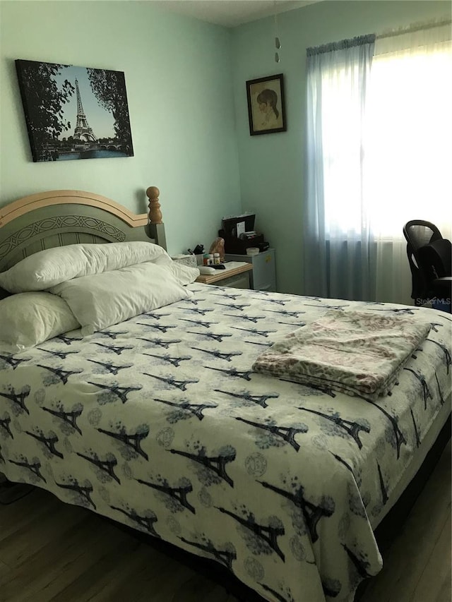 bedroom with wood finished floors