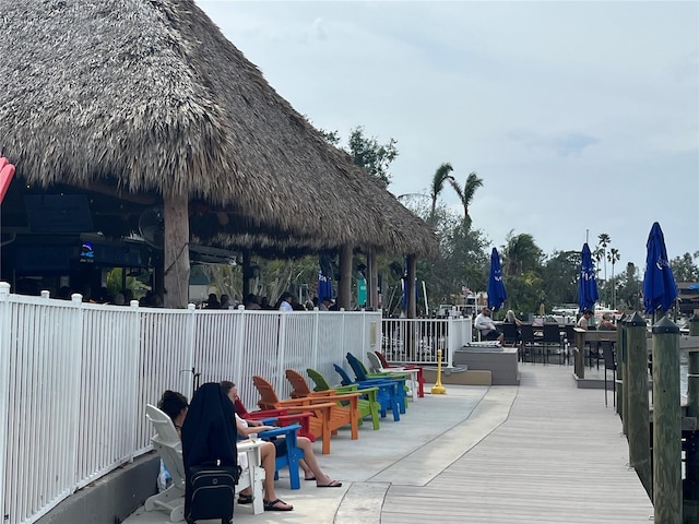 surrounding community with fence and a gazebo