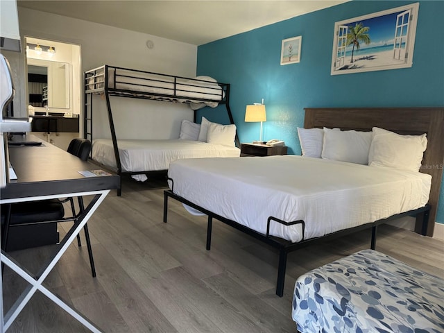 bedroom featuring wood finished floors