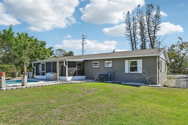 back of house with a yard, central AC unit, fence, and a sunroom