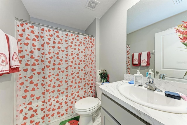 bathroom with toilet, visible vents, and vanity