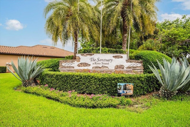 community sign with a lawn