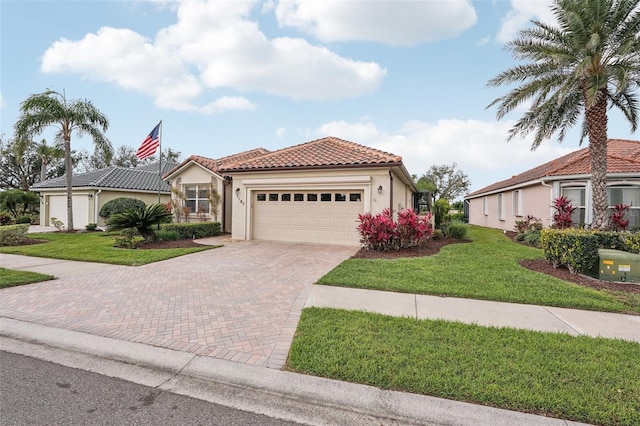 mediterranean / spanish-style house featuring a front yard, decorative driveway, a tiled roof, and stucco siding