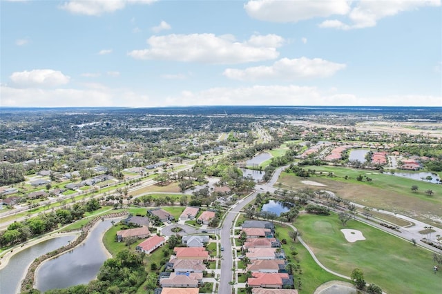 drone / aerial view featuring a residential view and a water view