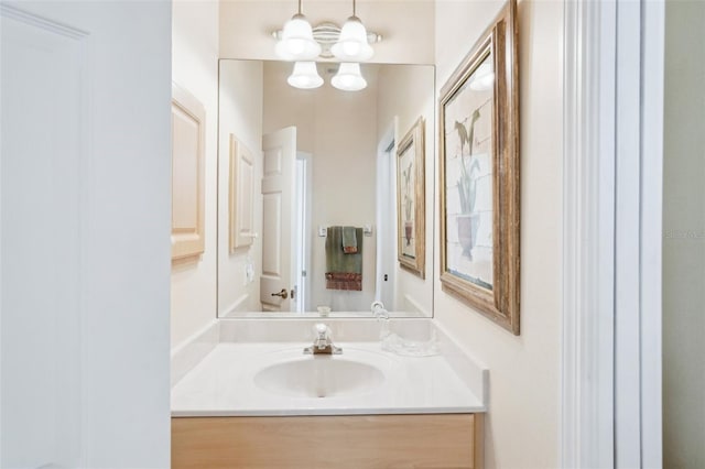 bathroom featuring vanity and an inviting chandelier